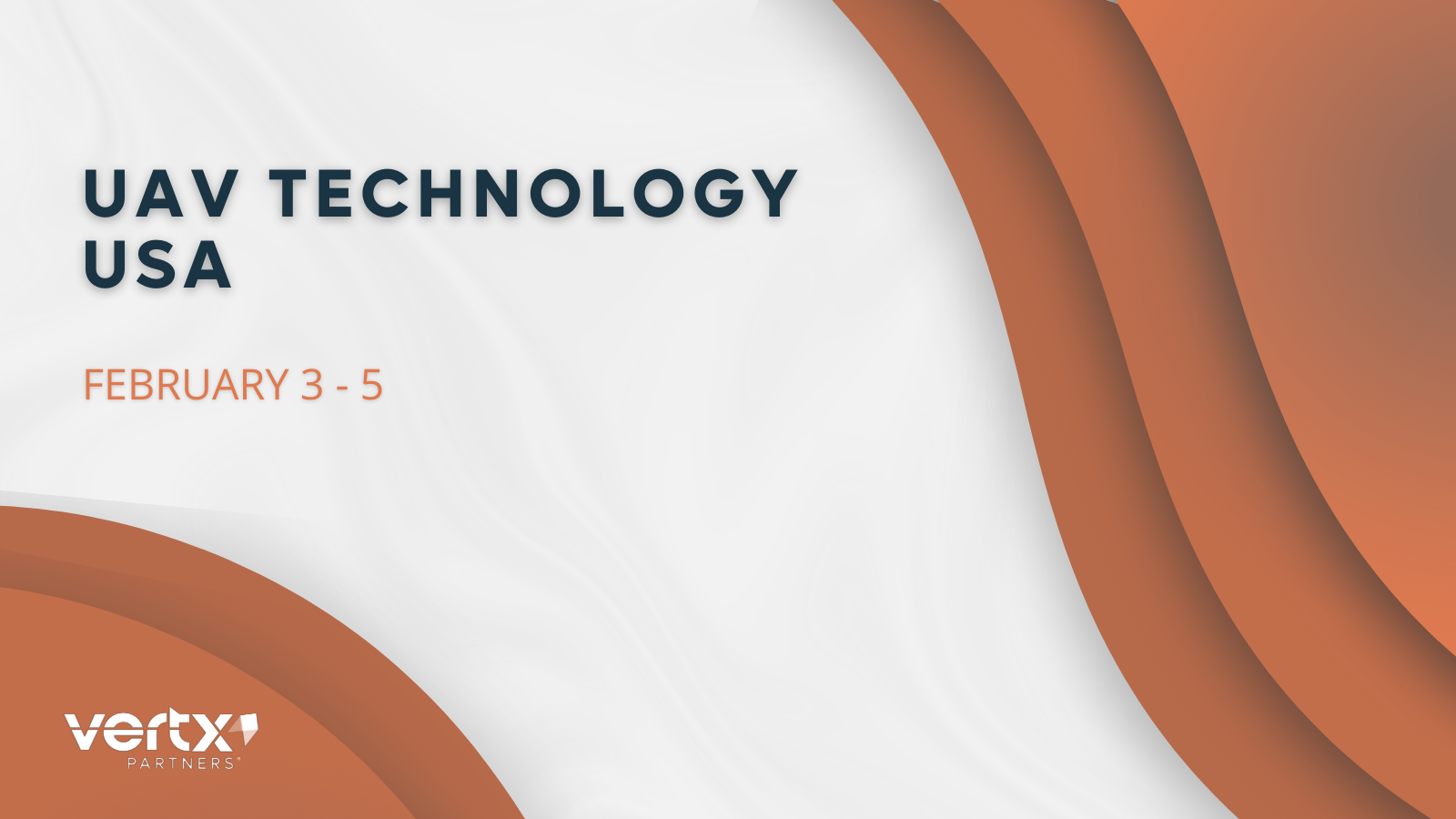 This graphic has the title UAV Technology USA with the dates feb 3 - 5 under it and 3 orange curves to the right of that and 2 orange curves to the left